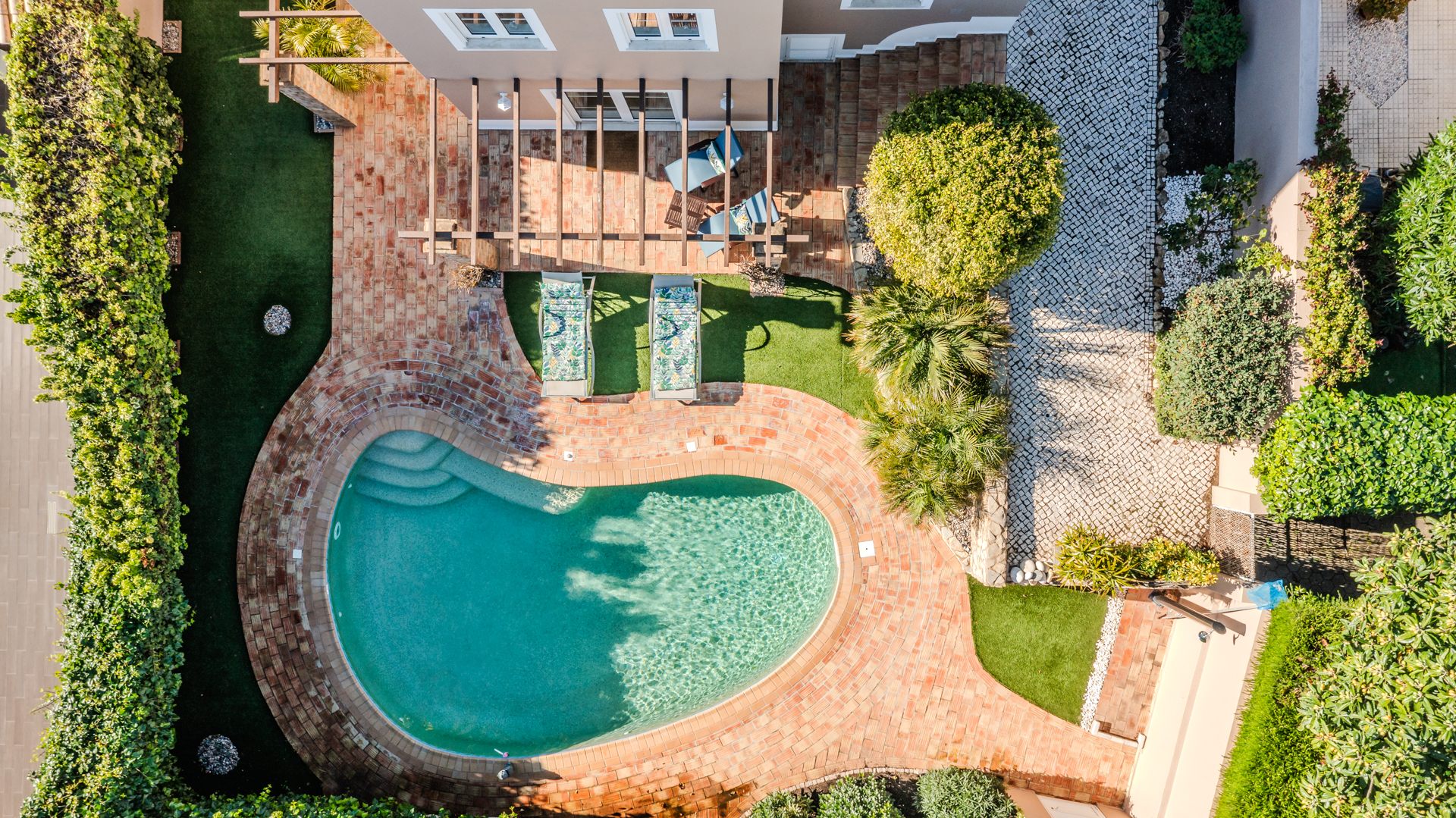 Drone view of pool in rear of property